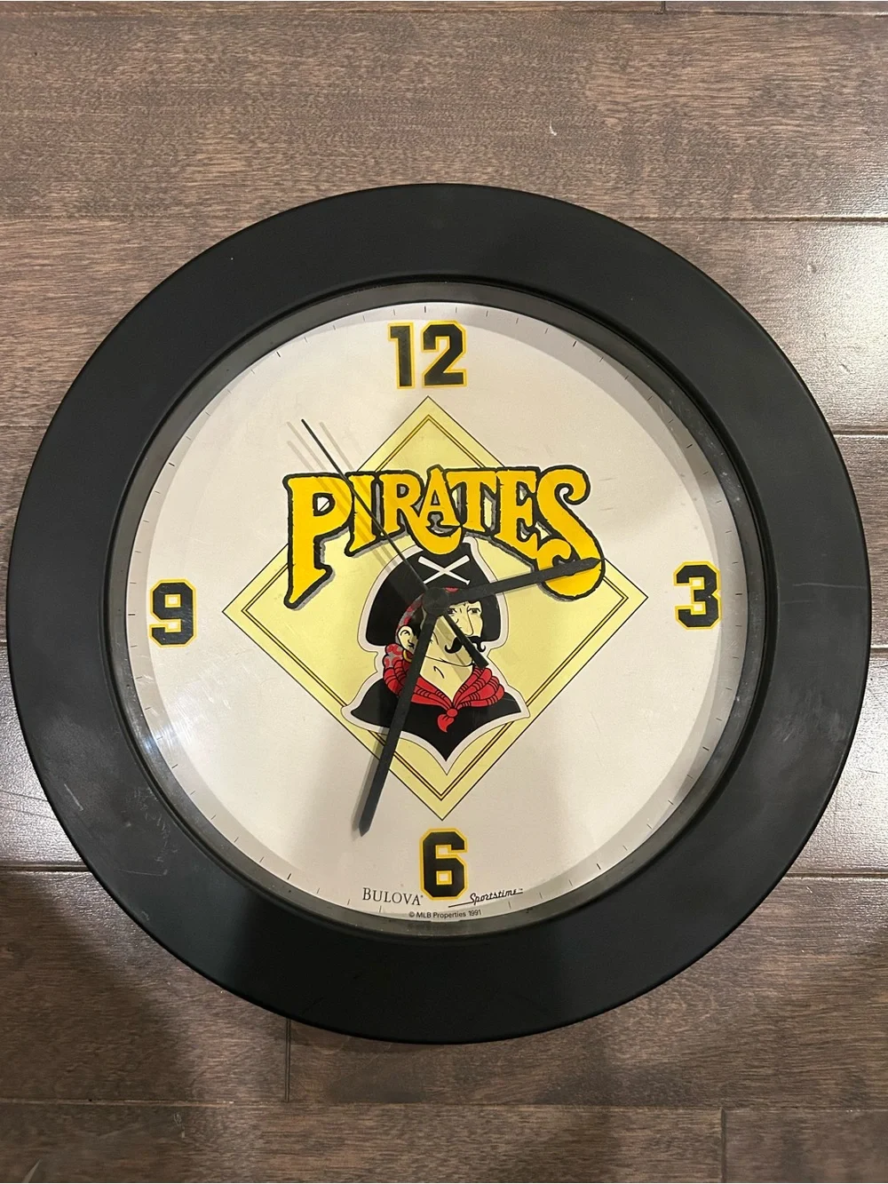 Bulova Pirates Wall Clock - Black and Yellow with Red Accent
